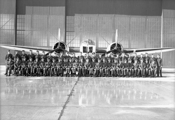 Aircrew of No.147 (BR) Squadron, Royal Canadian Air Force (R.C.A.F.), with a Bristol Bolingbroke IV aircraft, Tofino, B.C., March 10, 1944.