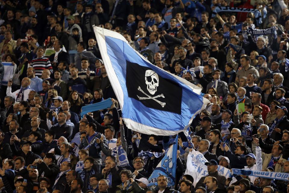 Napoli fans wave flags prior to the start of Italian Cup final match between Fiorentina and Napoli in Rome's Olympic stadium Saturday, May 3, 2014. (AP Photo/Gregorio Borgia, Pool)