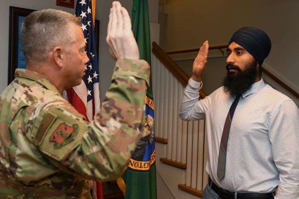 Gurchetan Singh recites the oath of enlistment on Sept. 27, 2019, at Camp Murray in Washington state. Singh is the first Sikh to enlist in the Air National Guard with a religious accommodation wavier that allows him to serve and still practice key elements of his religion. (Photo: Master Sgt. Tim Chacon/Air National Guard)