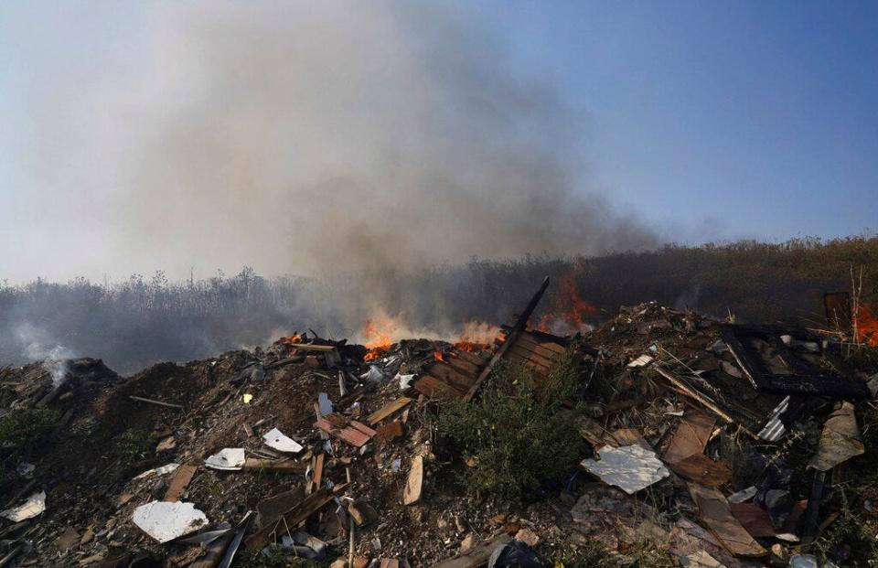 A blaze burns in the village of Wennington, east London, on July 19. The typically temperate nation of England was walloped by unusually hot, dry weather that triggered wildfires.