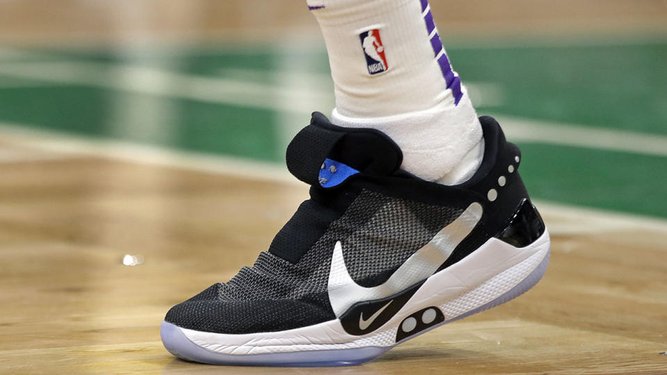 Los Angeles Lakers forward Kyle Kuzma walks on the court wearing The Nike Adapt BB, a self-lacing smart shoe that can be controlled by a smartphone. (AP Photo/Elise Amendola)