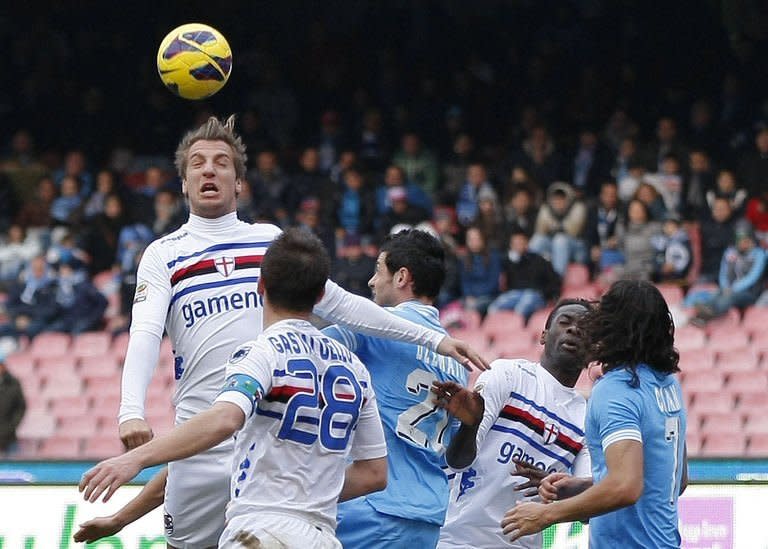 Sampdoria forward Maxi Lopez (L) heads the ball during the Italian Serie A football match against Napoli in San Paolo Stadium on February 17, 2013 in Naples. Sampdoria put the brakes on Napoli's Serie A title ambitions by holding the Neapolitans to a scoreless draw