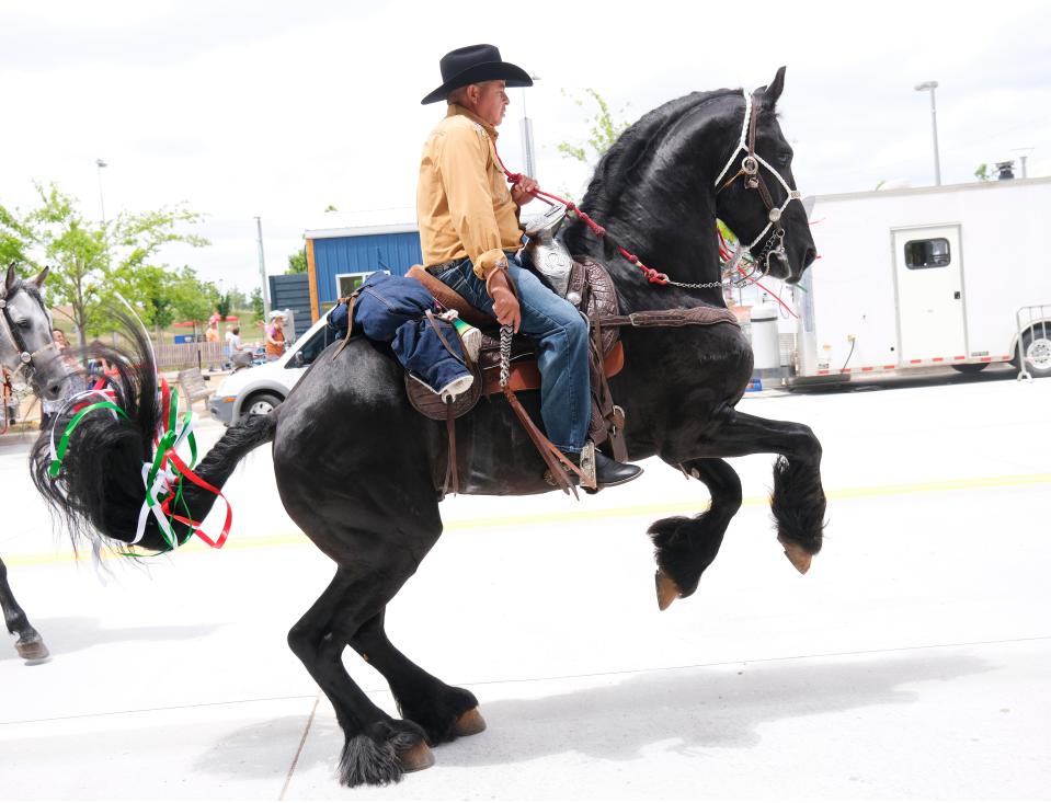 A rider has his horse dance in the parade May 2, 2021, during the Cinco de Mayo celebration at Scissortail Park.