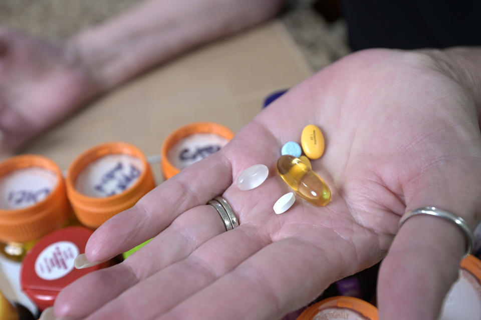 Retiree Donna Weiner shows some of the daily prescription medications that she needs and pays over $6,000 a year through a Medicare prescription drug plan at her home, Tuesday, Oct. 5, 2021, in Longwood, Fla. Weiner supports giving Medicare authority to negotiate drug prices. Negotiating Medicare drug prices is the linchpin of President Joe Biden's ambitious health care agenda. Not only would consumers see lower costs, but savings would be plowed into other priorities such as dental coverage for retirees and lower premiums for people with plans under the Obama-era health law. (AP Photo/Phelan M. Ebenhack)