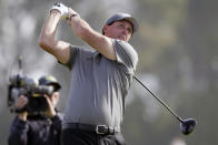 Phil Mickelson plays his shot from the 14th tee of the Torrey Pines North Course during the second round of the Farmers Insurance golf tournament in San Diego, Friday, Jan. 24, 2020. (AP Photo/Alex Gallardo)