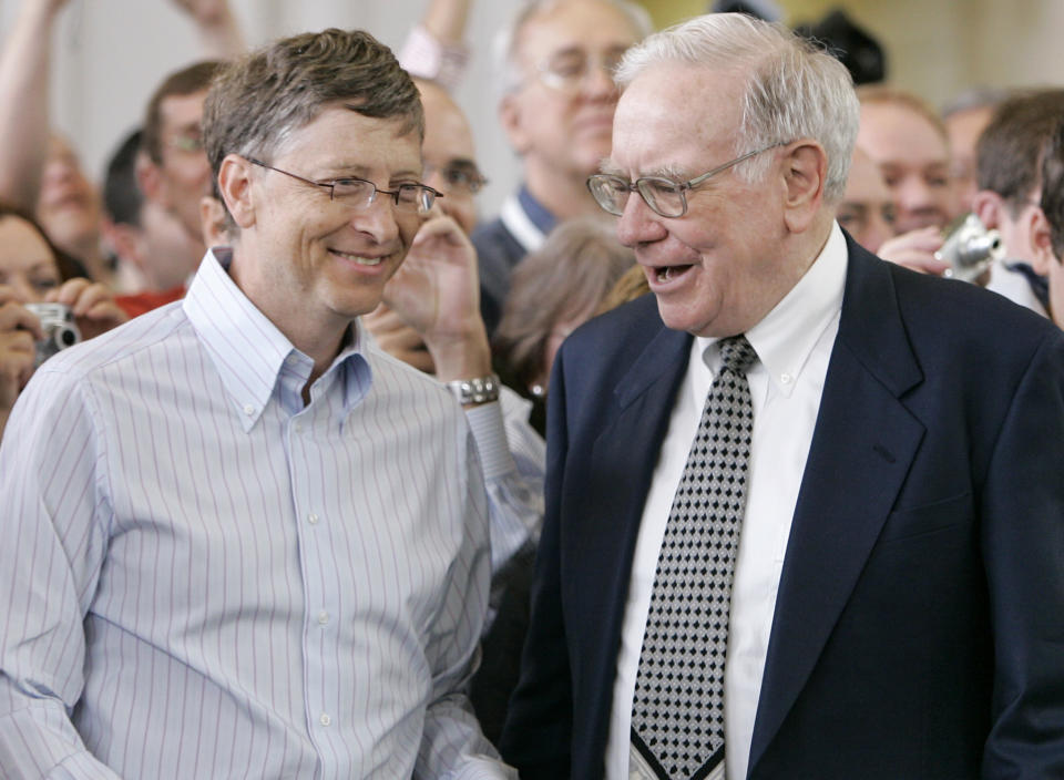 FILE - In this May 6, 2007 file photo, Microsoft co-founder Bill Gates, left, and billionaire investor Warren Buffett are seen during the annual Berkshire Hathaway shareholders meeting in Omaha, Neb. Gates and Buffett are launching a campaign to get other American billionaires to give at least half their wealth to charity. (AP Photo/Nati Harnik)