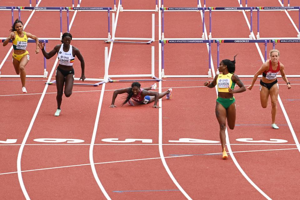 Nia Ali, pictured here after a devastating fall in the hurdles heats at the world championships.