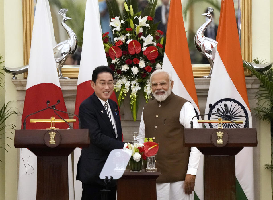 Japan’s Prime Minister Fumio Kishida, left and Indian Prime Minister Narendra Modi, shake hands after making press statements following their meeting in New Delhi, India, Monday, March 20, 2023. (AP Photo/Manish Swarup)