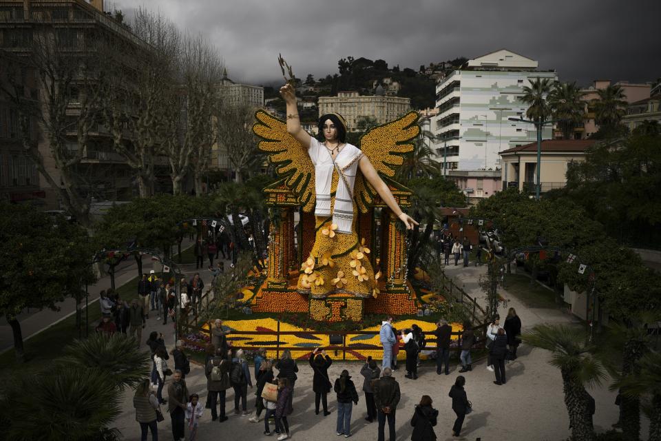 A sculpture of Nike the Greek god of victory made with lemons is displayed during the 90th edition of the Lemon Festival in Menton, France, Friday, March 1, 2024. (AP Photo/Daniel Cole)