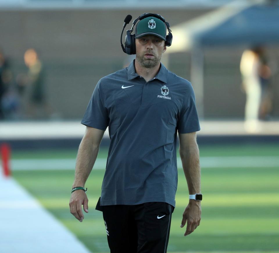 West Bloomfield head coach Zachary Hilbers on the sidelines against Birmingham Groves during first-half action at Birmingham Groves on Thursday, Aug. 31, 2023.