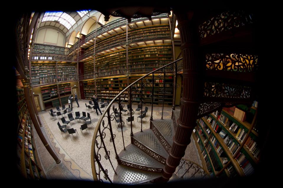 Fish-eye view of the library which houses about one fifth of the total collection of books during a press preview of the renovated Rijkmuseum in Amsterdam, Thursday April 4, 2013. The Rijksmusuem, home of Rembrandt's Night Watch and other national treasures, is preparing to reopen its doors on April 13 2013 after a decade-long renovation. (AP Photo/Peter Dejong)