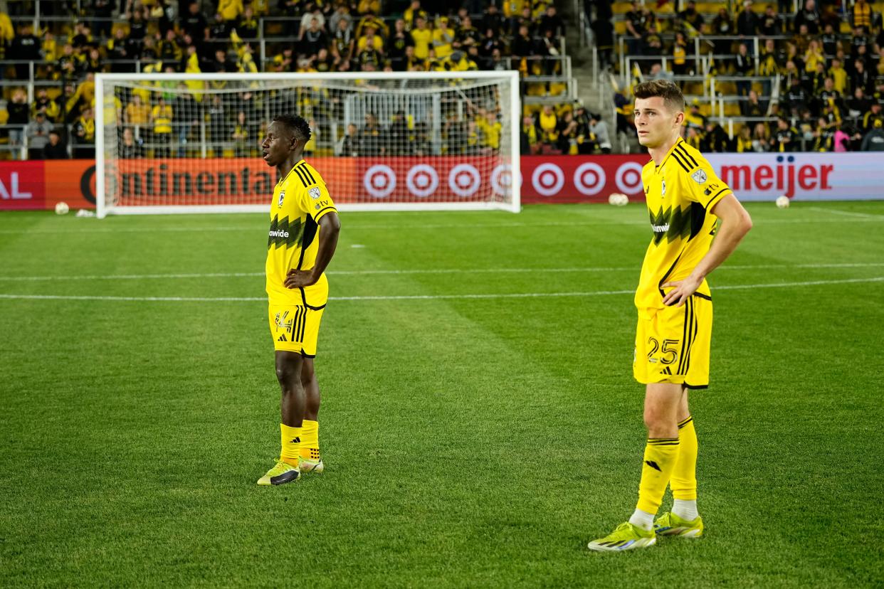 May 11, 2024; Columbus, OH, USA; Columbus Crew midfielder Yaw Yeboah (14) and midfielder Sean Zawadzki (25) stand at midfield following the MLS soccer game against FC Cincinnati at Lower.com Field. The Crew lost 2-1.