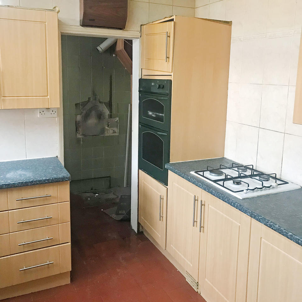 Before shot of a kitchen with wood effect units