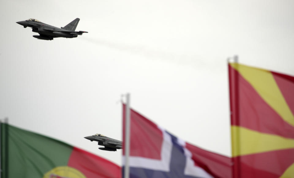 Italian Eurofighters fly over, during an inauguration ceremony at an airbase, in Kocuve, about 85 kilometers (52 miles) south of Tirana, Albania, Monday, March 4, 2024. NATO member Albania inaugurated an international tactic air base on Monday, the Alliance’s first one in the Western Balkan region. (AP Photo/Armando Babani)