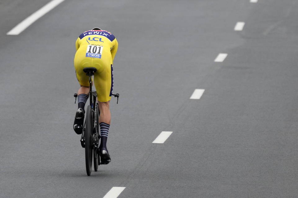 Netherland's Mathieu Van Der Poel, wearing the overall leader's yellow jersey, competes during the fifth stage of the Tour de France cycling race, an individual time-trial over 27.2 kilometers (16.9 miles) with start in Change and finish in Laval Espace Mayenne, France, Wednesday, June 30, 2021. (AP Photo/Daniel Cole)