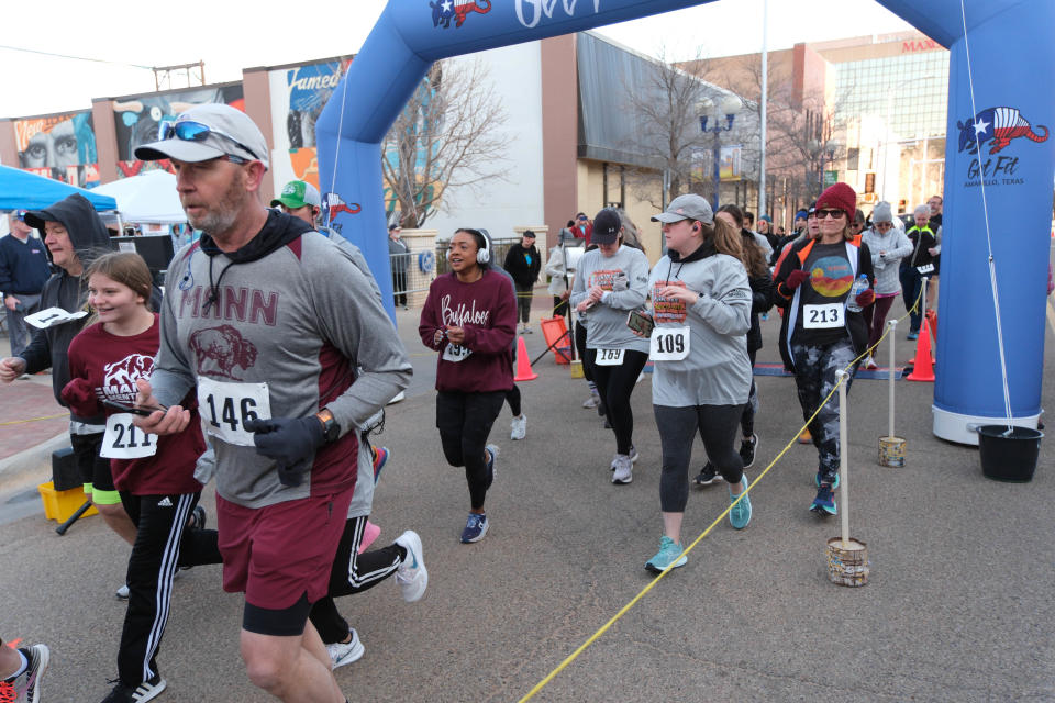 Runners start the first leg of the 2023 Center City Mural Run in downtown Amarillo.