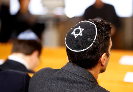 A man wearing a kippah is seen before a ceremony to mark the 80th anniversary of Kristallnacht, also known as the Night of Broken Glass, at Rykestrasse Synagogue, in Berlin, Germany, November 9, 2018. REUTERS/Fabrizio Bensch