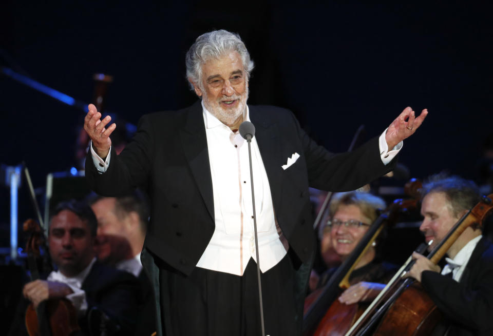 FILE - In this Aug. 28, 2019 file photo, opera star Placido Domingo salutes spectators at the end of a concert in Szeged, Hungary. The 78-year-old singer who rose to stardom as a tenor has been confirmed to sing the baritone title role in “Nabucco” at the Zurich Opera House this Sunday. It will be his first time performing since stepping down Oct. 2 as general director of the Los Angeles Opera and withdrawing from future performances at the company. (AP Photo/Laszlo Balogh, File)