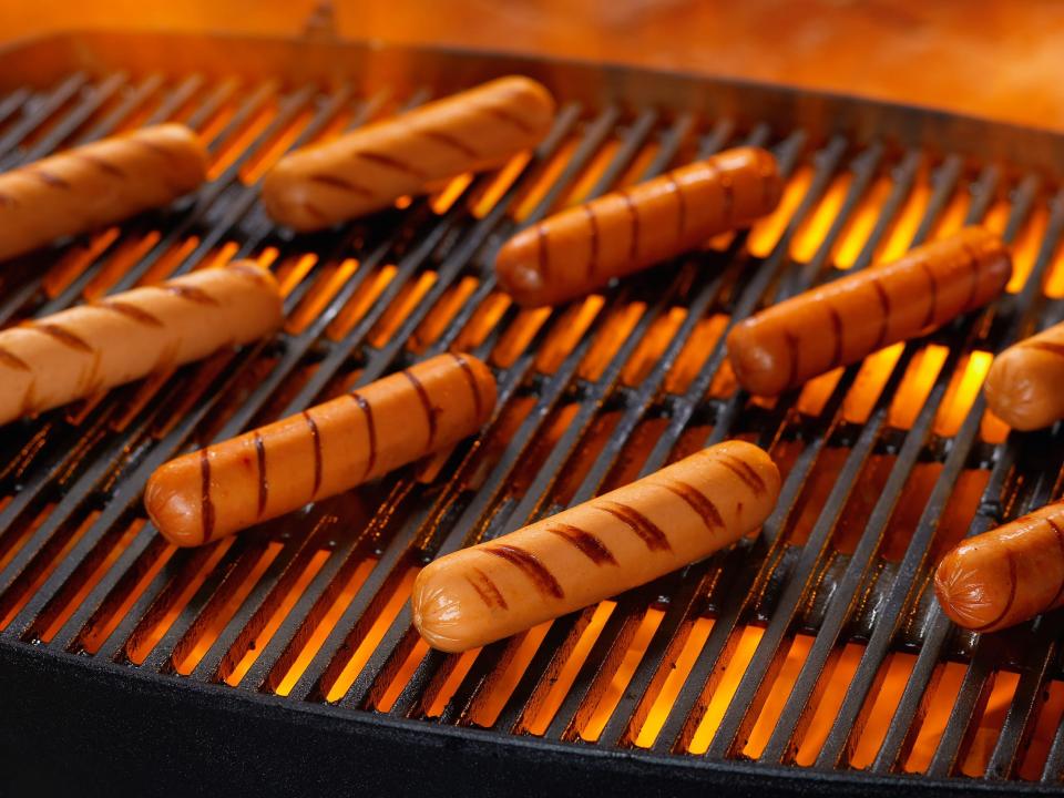 hot dogs on grill