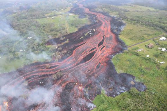 Kilauea's lava flows head downslope to the Pacific Ocean on May 19.