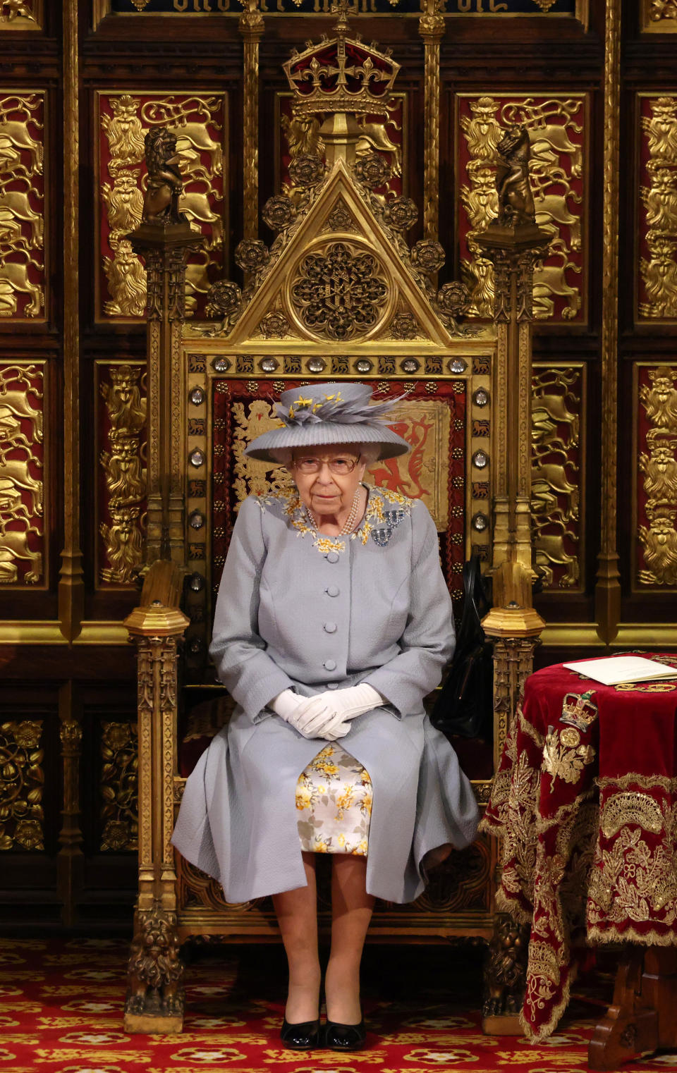 LONDON, ENGLAND - MAY 11:  Queen Elizabeth II ahead of the Queen's Speech in the House of Lord's Chamber during the State Opening of Parliament at the House of Lords on May 11, 2021 in London, England. (Photo by Chris Jackson - WPA Pool/Getty Images)