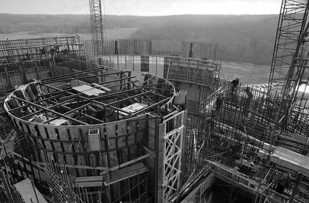 The cylindrical reactor core for the Shoreham Nuclear Plant in Brookhaven, New York, sits in the foreground as construction work continues on it, Jan. 17, 1977.