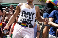 NEW YORK - JUNE 24: A man wears a shirt that reads "gay is the new straight" during the New York City Gay Pride March on June 24, 2012 in New York City. The annual civil rights demonstration commemorates the Stonewall riots of 1969, which erupted after a police raid on a gay bar, the Stonewall Inn on Christopher Street. (Photo by Michael Nagle/Getty Images)