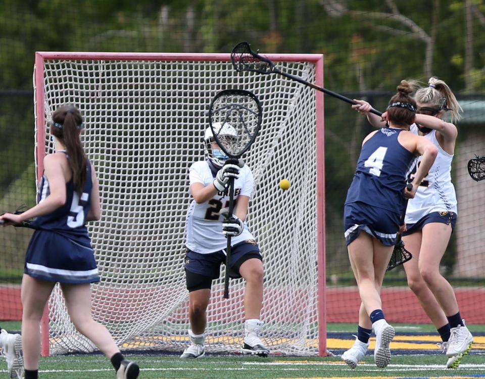 Lourdes goalkeeper Norah Zuidema readies to make a save of a shot against Putnam Valley during a May 10, 2021 girls lacrosse game.