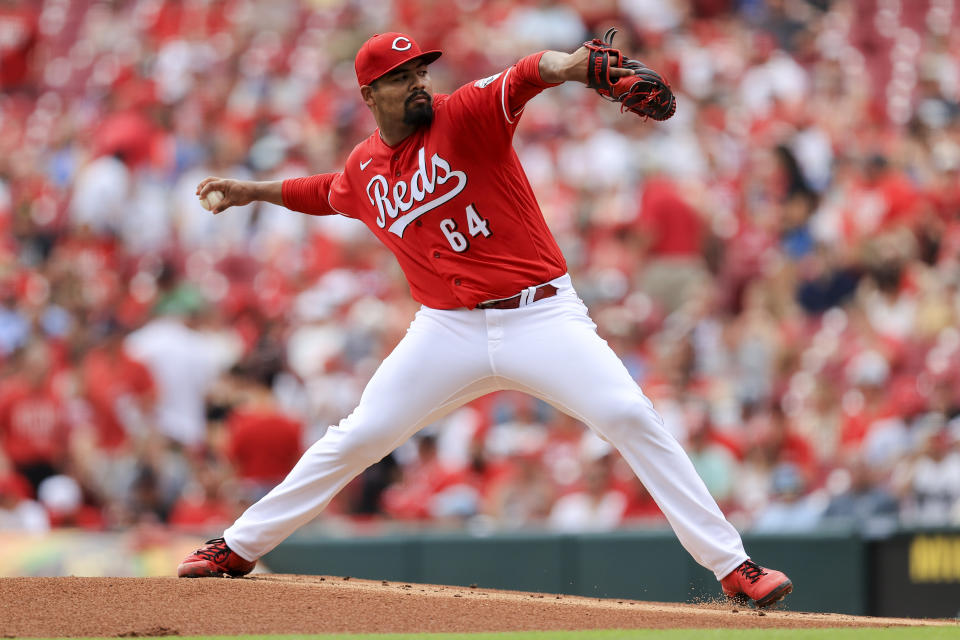 Cincinnati Reds' Tony Santillan throws during the first inning of a baseball game against the Colorado Rockies in Cincinnati, Sunday, June 13, 2021. (AP Photo/Aaron Doster)