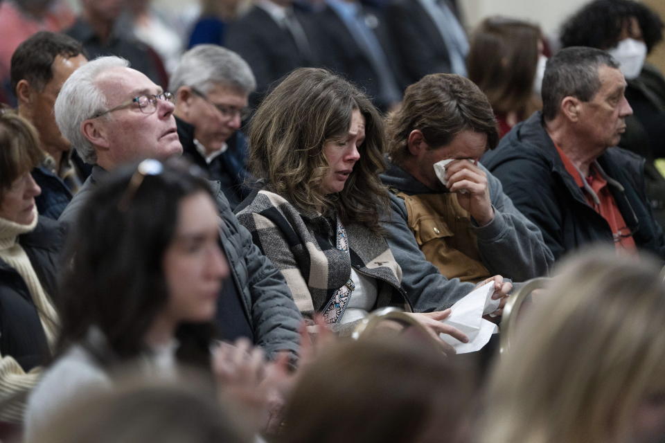 Friends, family, and supporters of the victims of the mass killings in rural Nova Scotia in 2020 react at the beginning of the release of the Mass Casualty Commission inquiry's final report in Truro, Nova Scotia, Thursday, March 30, 2023. (Darren Calabrese/The Canadian Press via AP)