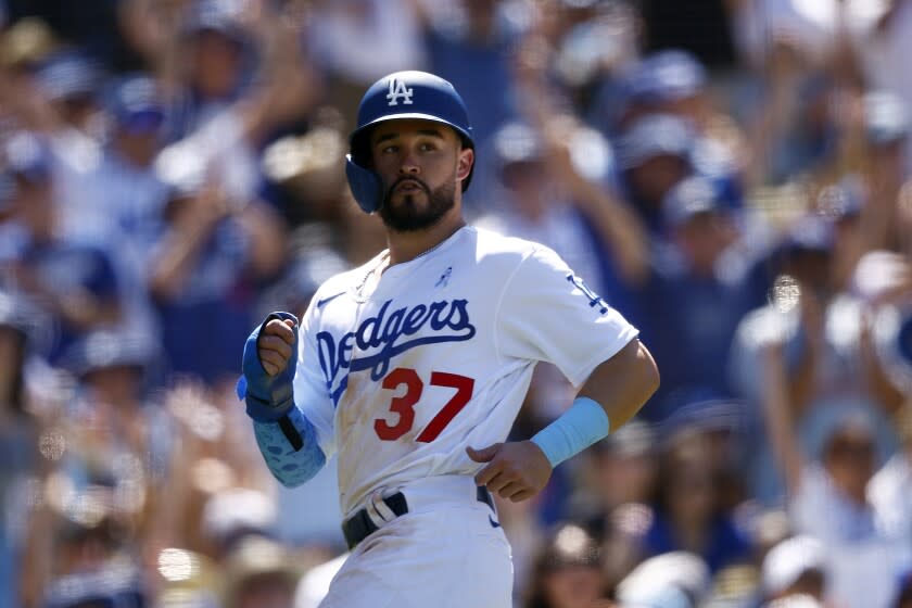 LOS ANGELES, CALIFORNIA - JUNE 19: Eddy Alvarez #37 of the Los Angeles Dodgers scores a run.