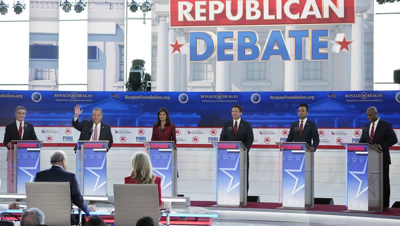 Republican presidential candidates, from left, North Dakota Gov. Doug Burgum, former New Jersey Gov. Chris Christie, former U.N. Ambassador Nikki Haley, Florida Gov. Ron DeSantis, entrepreneur Vivek Ramaswamy, and Sen. Tim Scott, R-S.C., stand at their podiums during a Republican presidential primary debate hosted by Fox Business Network and Univision, Wednesday, Sept. 27, 2023, at the Ronald Reagan Presidential Library in Simi Valley, Calif.