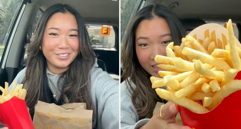 Woman sitting in car holding large McDonald's fries. 