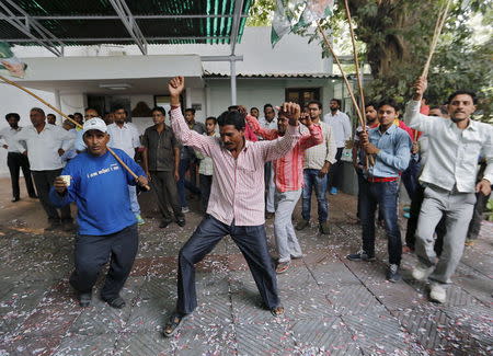 Supporters of Janata Dal (United) celebrate after learning the initial results inside the residence of the party leader Sharad Yadav in New Delhi, India, November 8, 2015. REUTERS/Anindito Mukherjee