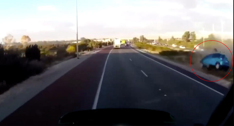 The airbourne car bounced a number of times as it made its way to the other side of the Perth highway median strip. Source: Dash Cam Owner Australia / Facebook