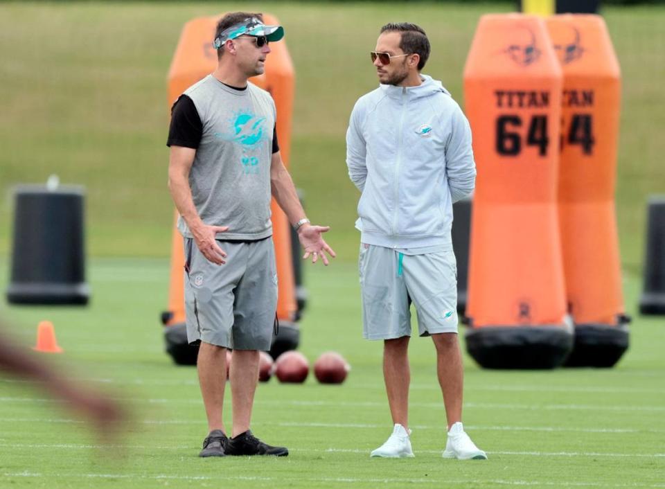 Miami Dolphins head coach Mike McDaniel, at right, speaks with Defensive Coordinator Josh Boyer practice at Baptist Health Training Complex in Miami Gardens on Wednesday, September 21, 2022.