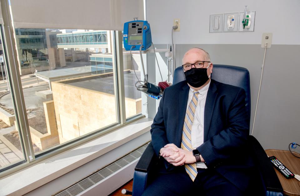 Jay Collier, vice president of clinic operations at UnityPoint Health, sits in an infusion room at the hospital in Downtown Peoria. Collier, 61, contracted COVID-19 in December 2020 and received an infusion of monoclonal antibodies that he believes greatly improved his prognosis.