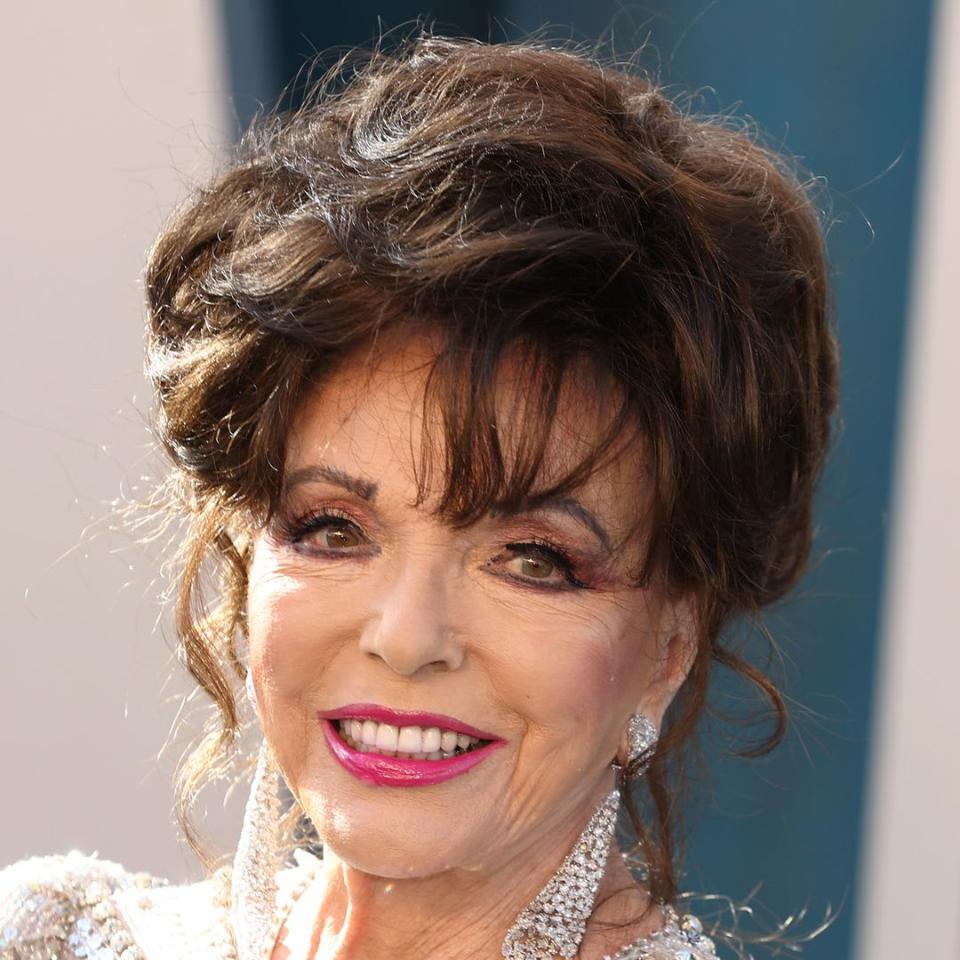 Joan Collins, 90, looks ageless as she soaks up the sun in strappy dress