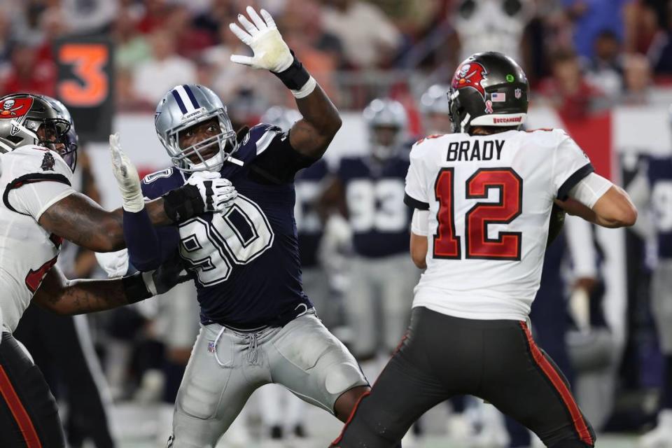 Dallas Cowboys defensive end DeMarcus Lawrence pressures Tampa Bay Buccaneers quarterback Tom Brady during the second half of an NFL football game Sept. 9 in Tampa, Florida. Lawrence, a Boise State alum, had five tackles and one forced fumble.