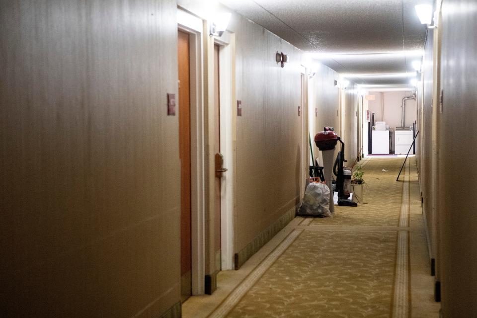 Personal belongings are stacked in a hallway at the Ramada Inn as emergency shelter residents prepare to leave March 30, 2022 in East Asheville.