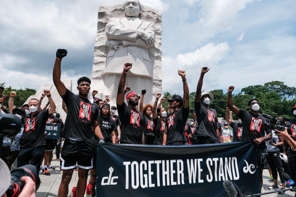 Members of the Washington Wizards and Washington Mystics basketball teams rally at the MLK Memorial to support Black Lives Matter and to mark the liberation of slavery on June 19, 2020 in Washington, DC (Getty Images)