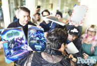 <p>The actor took some time to sign posters for fans before heading into The Beverly Hilton, where the show was held. </p>