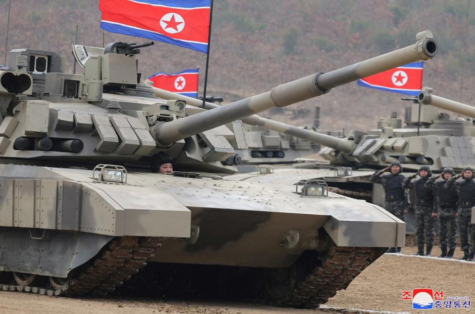 North Korean leader Kim Jong Un sits inside a tank during a military demonstration.