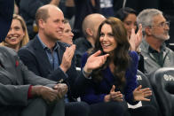 Britain's Prince William and Kate, Princess of Wales, right, laugh during the second half of an NBA basketball game between the Boston Celtics and the Miami Heat, Wednesday, Nov. 30, 2022, in Boston. (AP Photo/Charles Krupa)