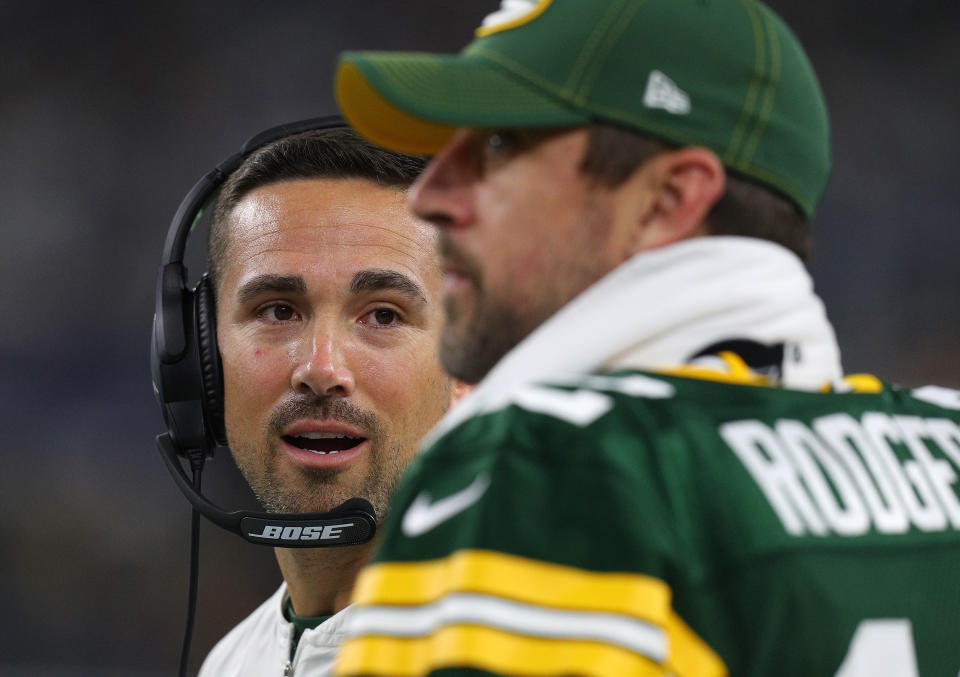 ARLINGTON, TEXAS - OCTOBER 06: Head coach Matt LaFleur of the Green Bay Packers talks with quarterback Aaron Rodgers #12 on the sidelines during the game against the Dallas Cowboys at AT&T Stadium on October 06, 2019 in Arlington, Texas. (Photo by Richard Rodriguez/Getty Images)