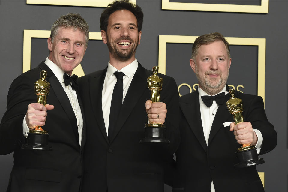 Dominic Tuohy, from left, Guillaume Rocheron, and Greg Butler, winners of the award for best visual effects for "1917", pose in the press room at the Oscars on Sunday, Feb. 9, 2020, at the Dolby Theatre in Los Angeles. (Photo by Jordan Strauss/Invision/AP)