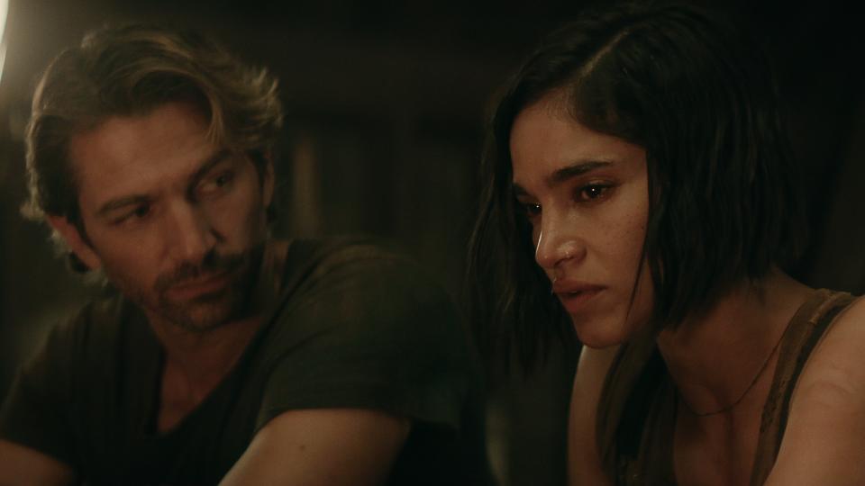 Gunnar (Michiel Huisman) and Kora (Sofia Boutella) side by side in Rebel Moon — Part Two: The Scargiver.