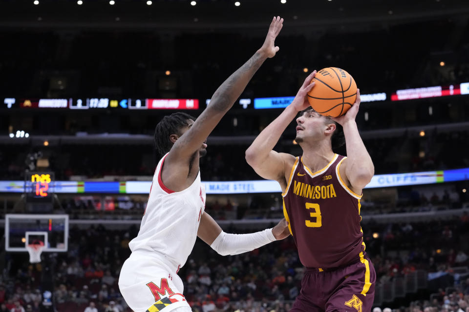 Minnesota's Dawson Garcia looks to shoot as Maryland's Hakim Hart defends during the first half of an NCAA college basketball game at the Big Ten men's tournament, Thursday, March 9, 2023, in Chicago. (AP Photo/Charles Rex Arbogast)
