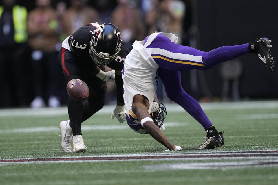 Atlanta Falcons safety Jessie Bates III (3) breaks up a pass intended for Minnesota Vikings wide receiver Jordan Addison, right, during the second half of an NFL football game, Sunday, Nov. 5, 2023, in Atlanta. (AP Photo/John Bazemore)