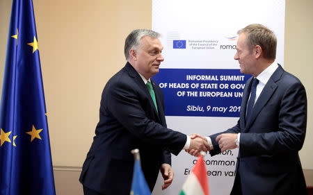 European Council President Donald Tusk shakes hands with Hungarian Prime Minister Viktor Orban prior the informal meeting of European Union leaders in Sibiu, Romania May 9, 2019. Virginia Mayo/Pool via REUTERS